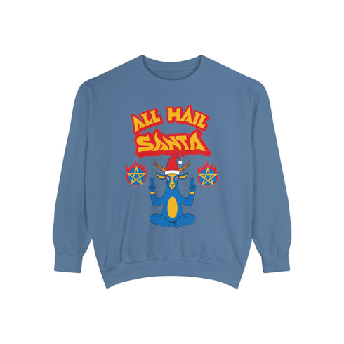 A Christmas sweatshirt featuring a playful design with a cartoon Baphomet goat character wearing a Santa hat. The design includes the text "All Hail Santa" above the goat, with pentagrams in flames on either side. The goat is depicted in a meditative pose, adding a humorous and irreverent twist to holiday attire.